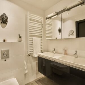 a-bathroom-with-a-sink-and-a-mirror-2023-06-09-21-33-36-utc