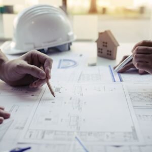 engineers-are-helping-to-design-work-on-blueprints-2022-12-16-03-37-48-utc